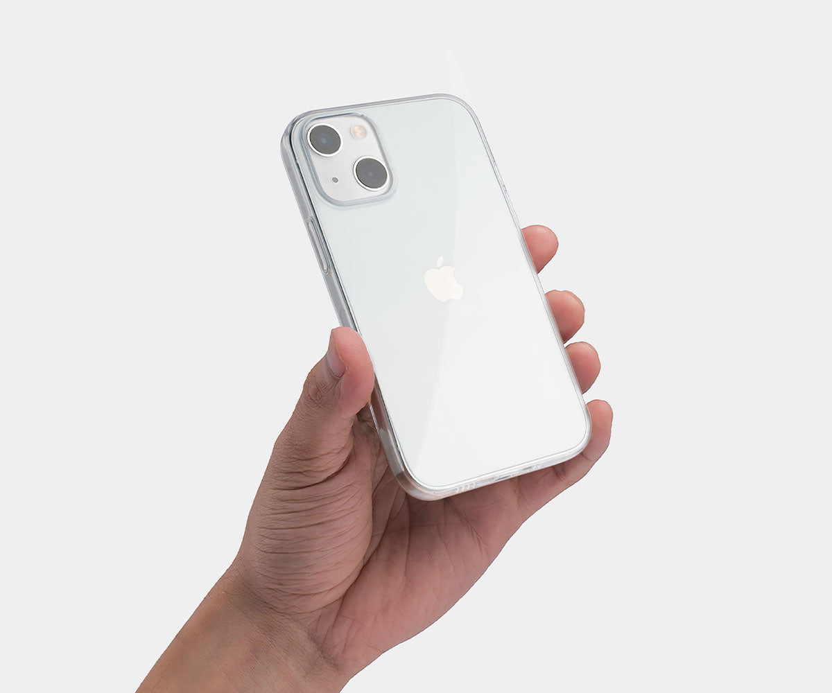 a hand holding a clear iphone 13 case on an iphone