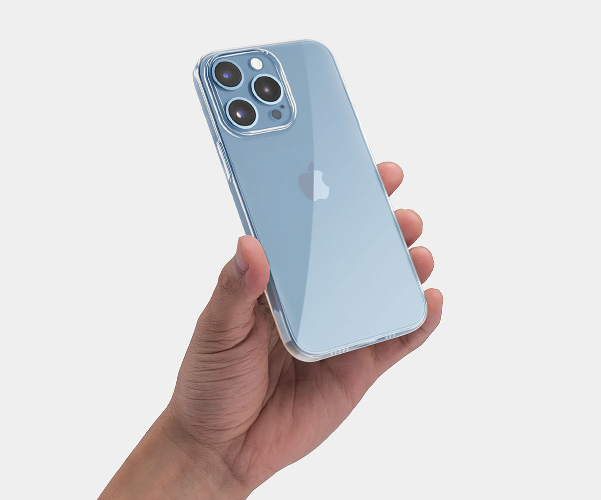 a hand holding an iphone with a clear iphone 13 pro case
