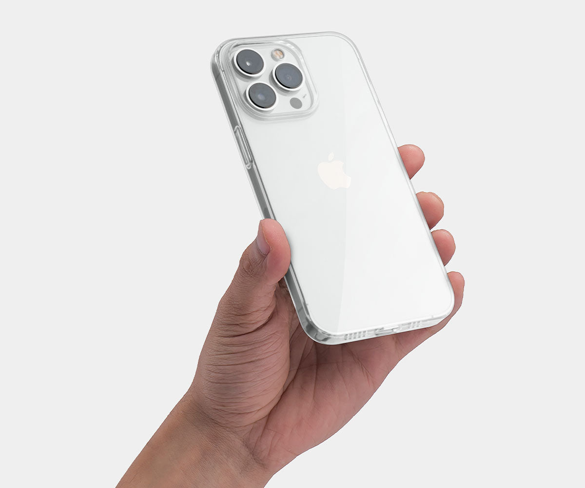 hand holding an iPhone with a clear iPhone 14 Pro Max case