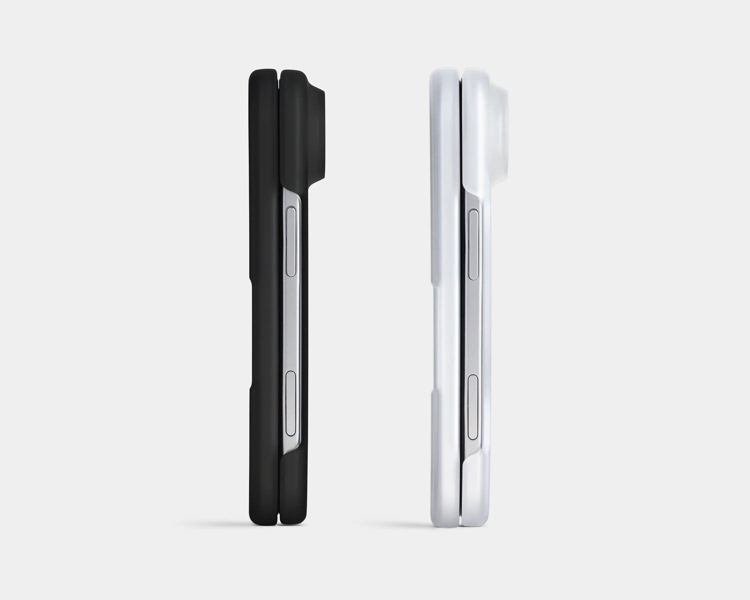 Two slim smartphone cases shown side by side in a clean studio render: one black and one white, both with a large rear camera cutout and side button openings, on a light gray background.